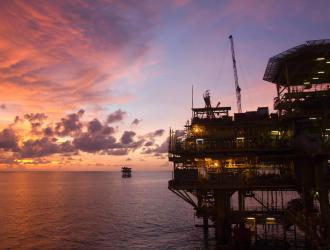 Offshore oil platform at dusk